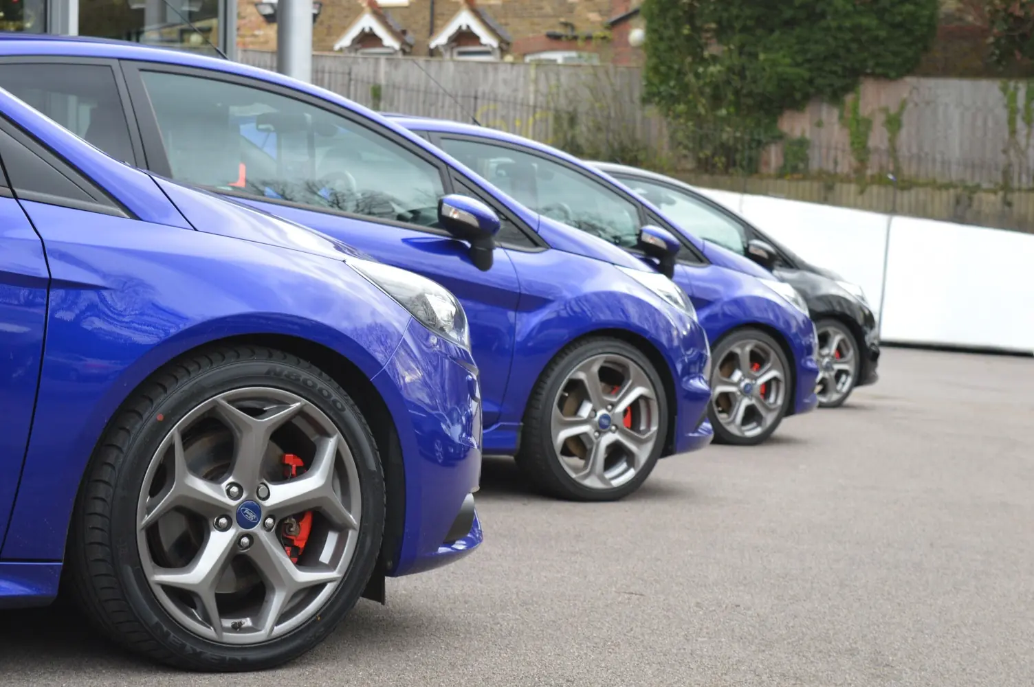 Cars lined up on a dealership forecourt