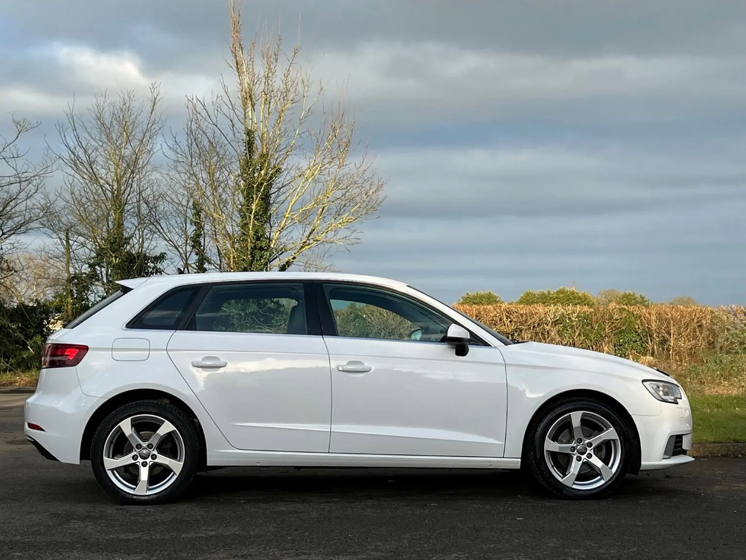White Audi A3 photographed in side profile